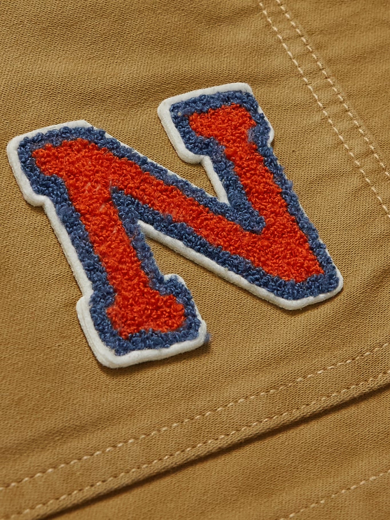 Nudie Jeans - NUDIE JEANS HOWOE LOGO-APPLIQUÉD COTTON-CANVAS CHORE JACKET IN BROWN - Rent With Thred
