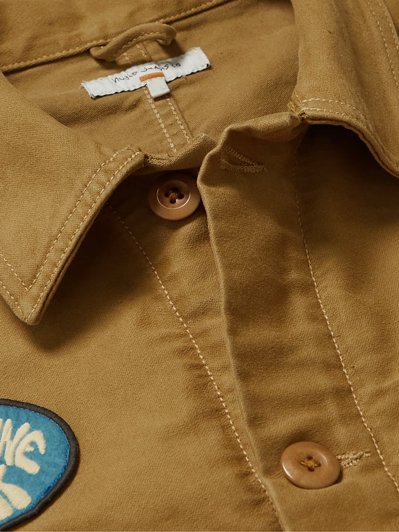 Nudie Jeans - NUDIE JEANS HOWOE LOGO-APPLIQUÉD COTTON-CANVAS CHORE JACKET IN BROWN - Rent With Thred