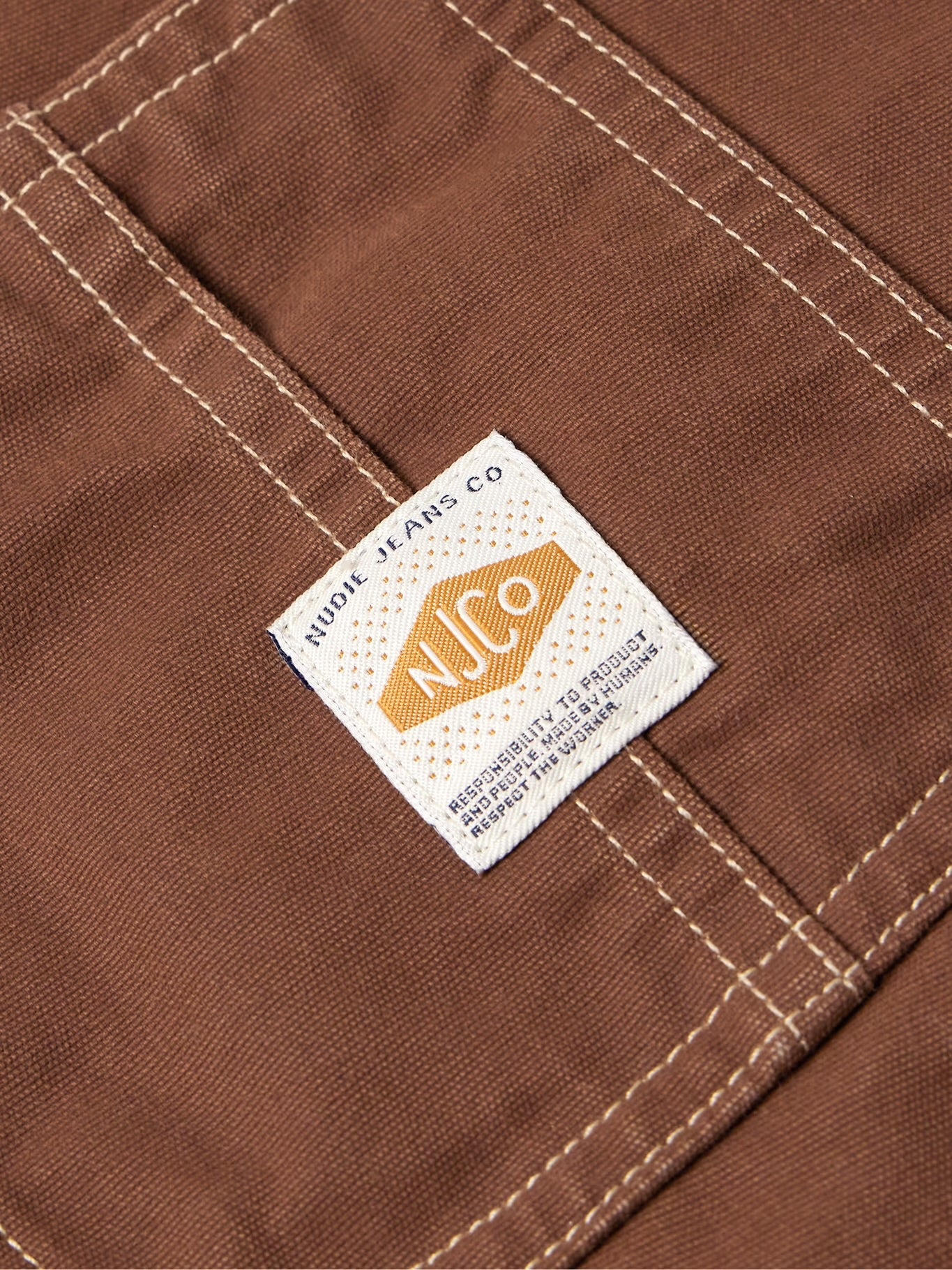 NUDIE JEANS HOWIE LOGO-APPLIQUÉD COTTON-CANVAS CHORE JACKET IN BROWN in BROWN — view 3